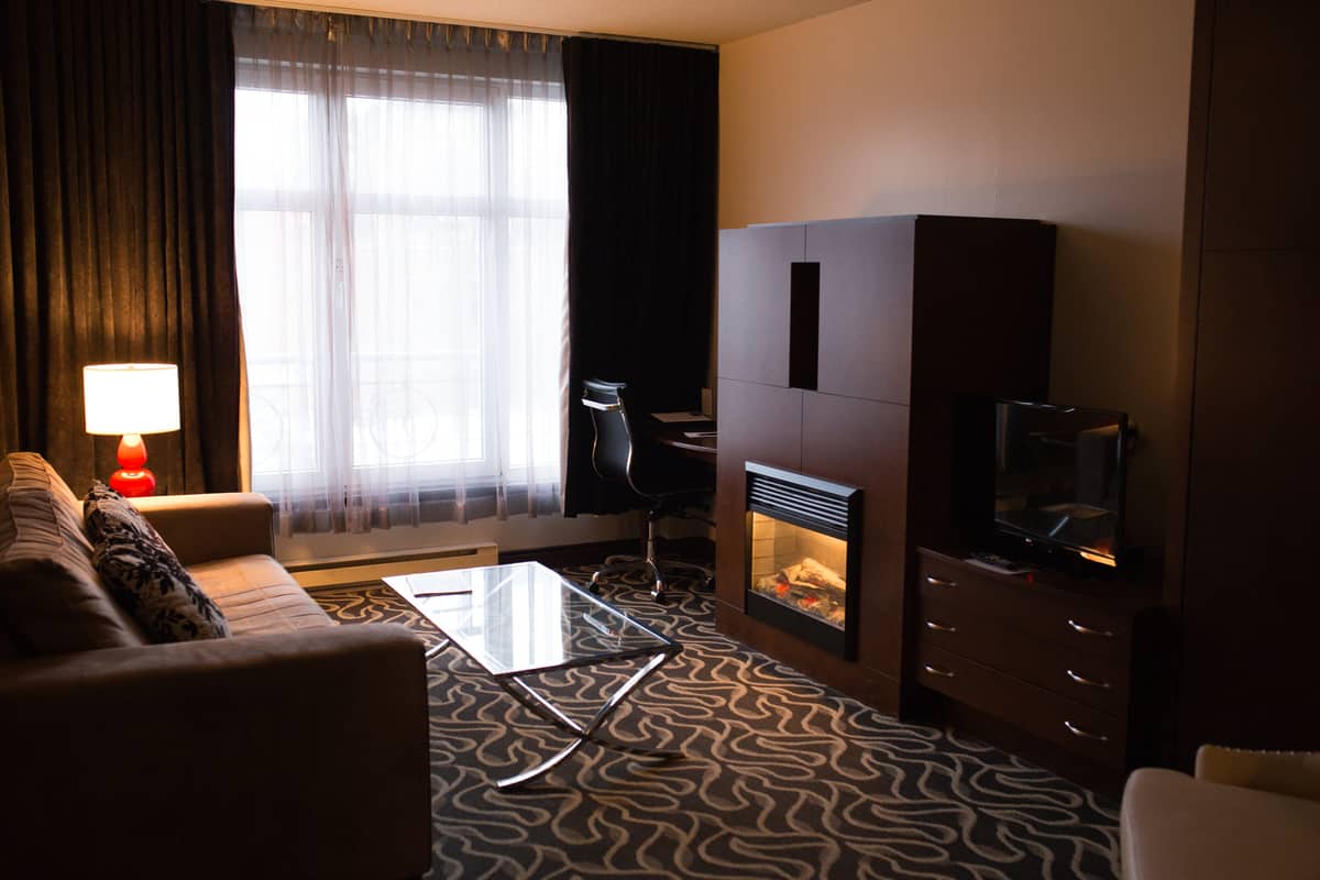 Enjoy a deluxe suite with fireplace during your stay in Montreal at le saint-sulpice hotel. SoSulpice!eplace 